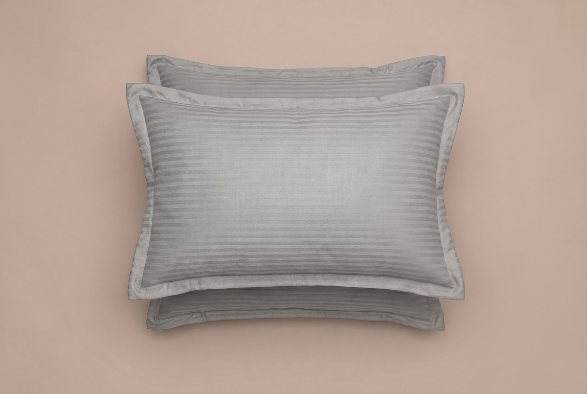Two gray pillows on a beige background